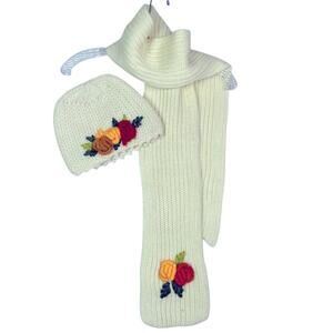 Hand knitted hat and scarf set with beautiful colorful rosettes